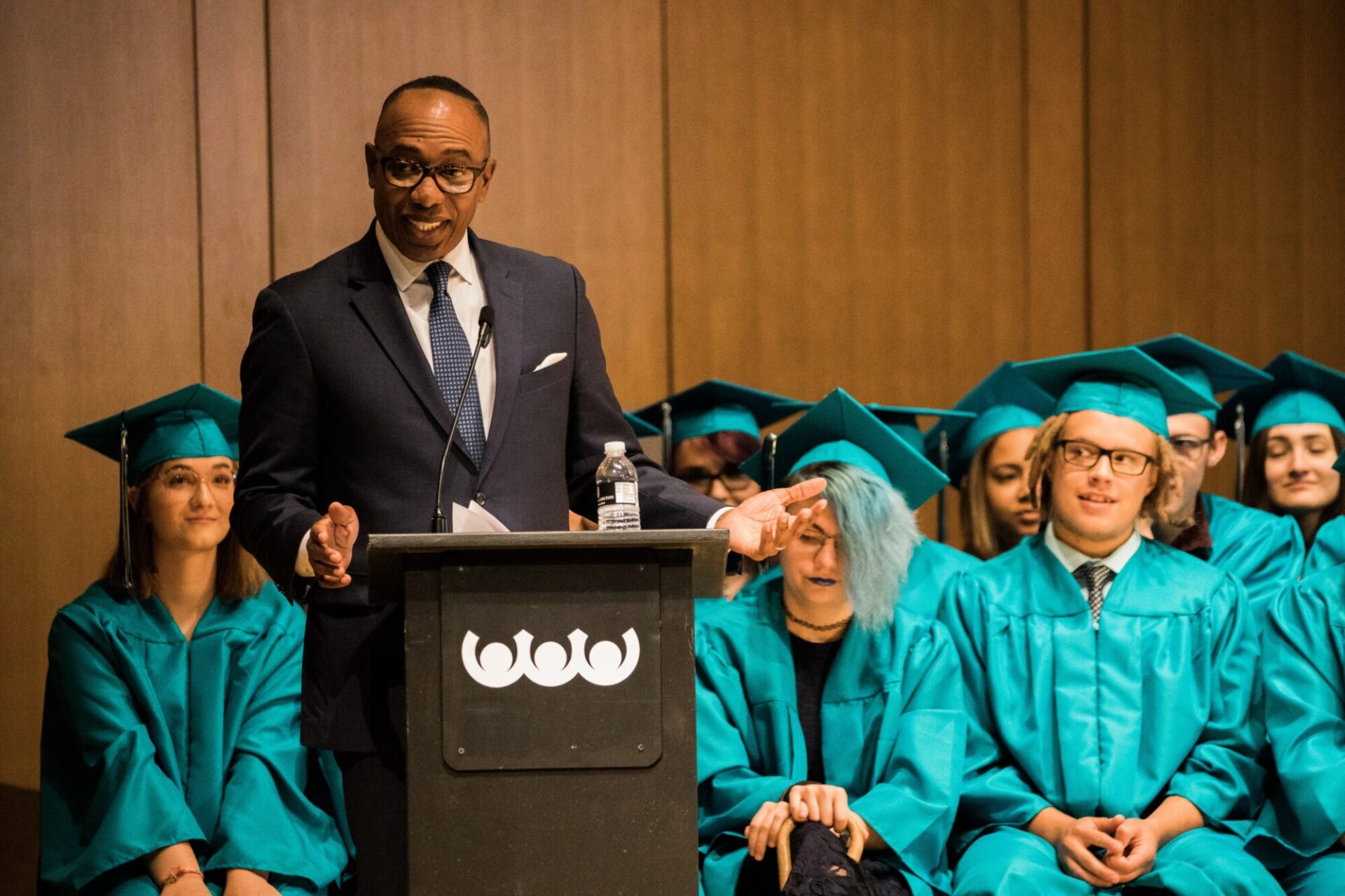 PPOS team member giving a speech at the graduation ceremony