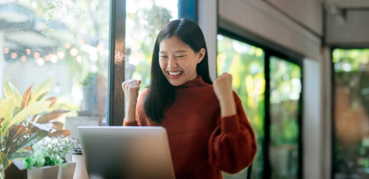 Student smiling to her laptop